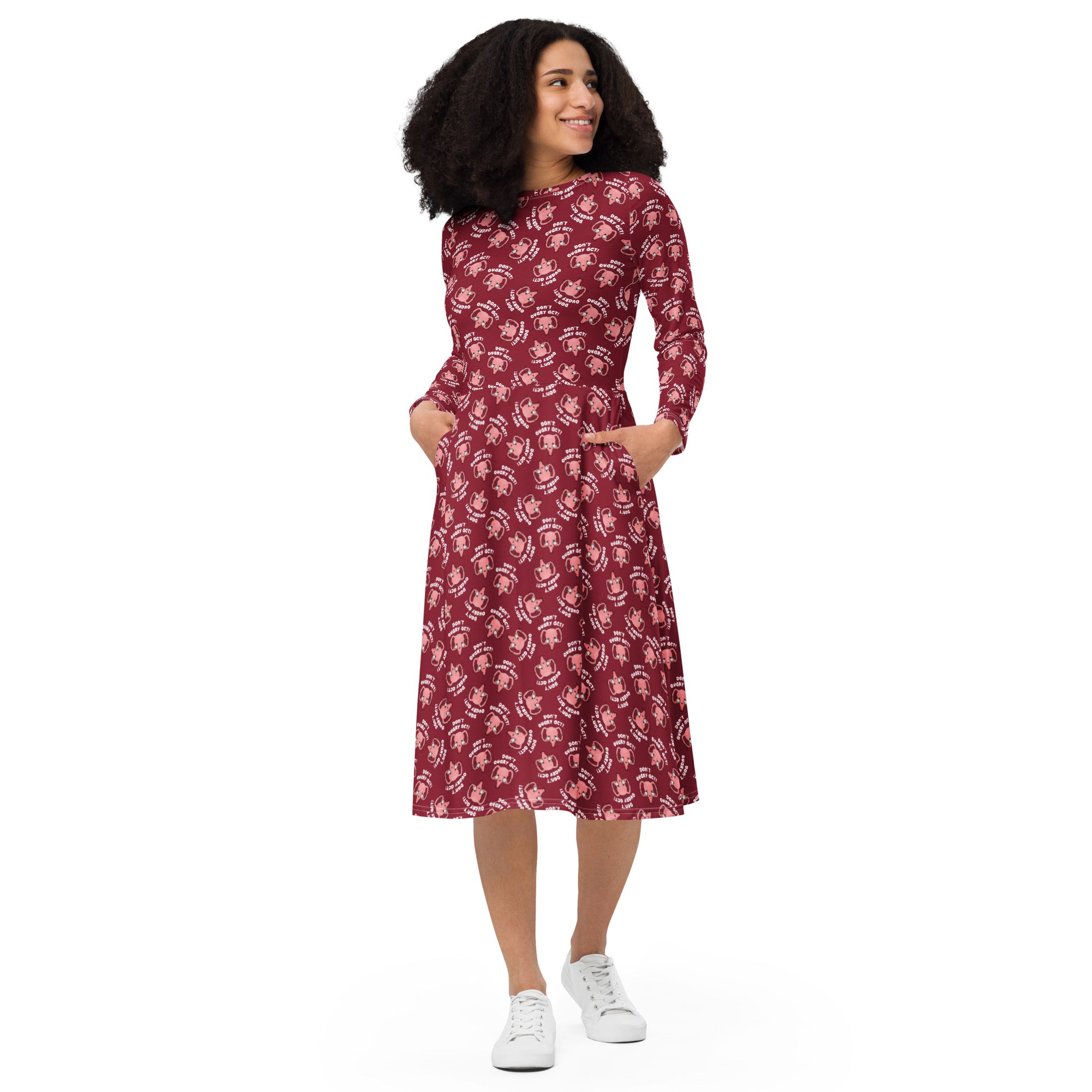 Blood red coloured mid length dress on a female model with repetitive pattern of  cute uterus character crying with tears of blood with the text in red Don't Ovary Act